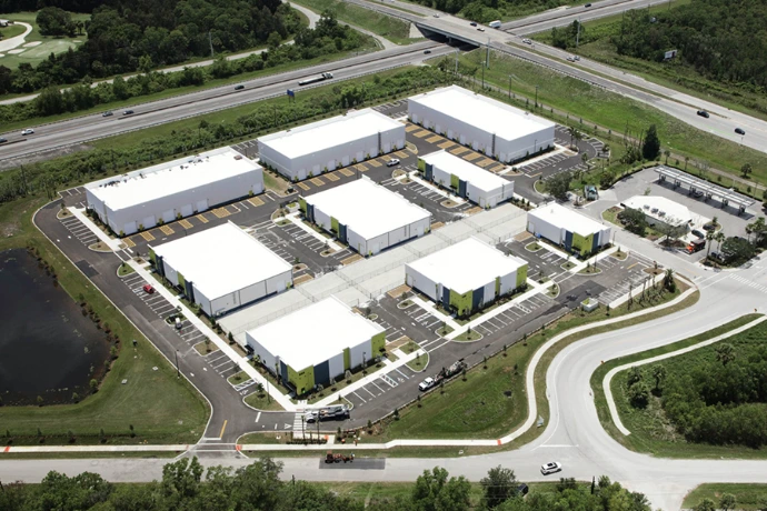 Aerial view of a connected commercial business park representing shared operations